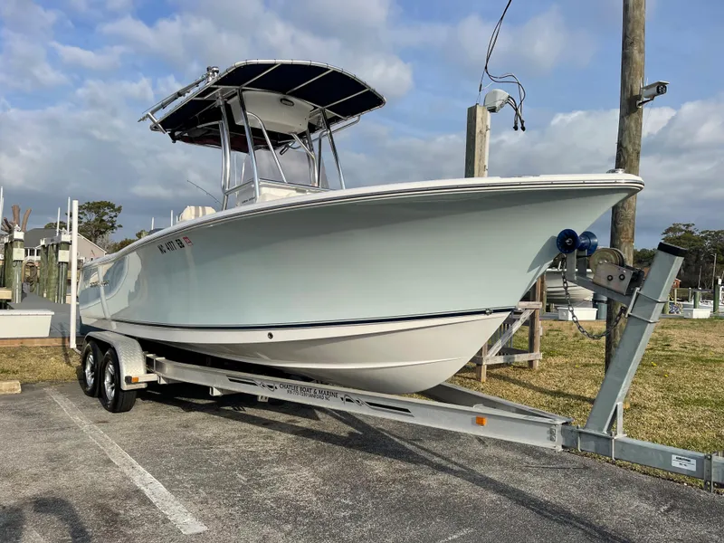 Slide: The Image of 2015 Sea Hunt Ultra 234 boat on trailer outdoors. - 0