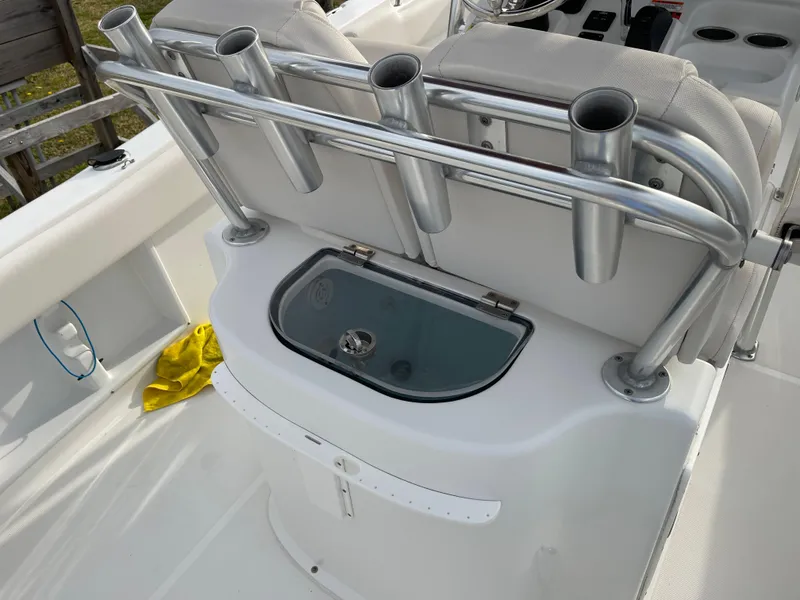 Slide: The Image of 2015 Sea Hunt Ultra 234 boat with rod holders and storage. - 23