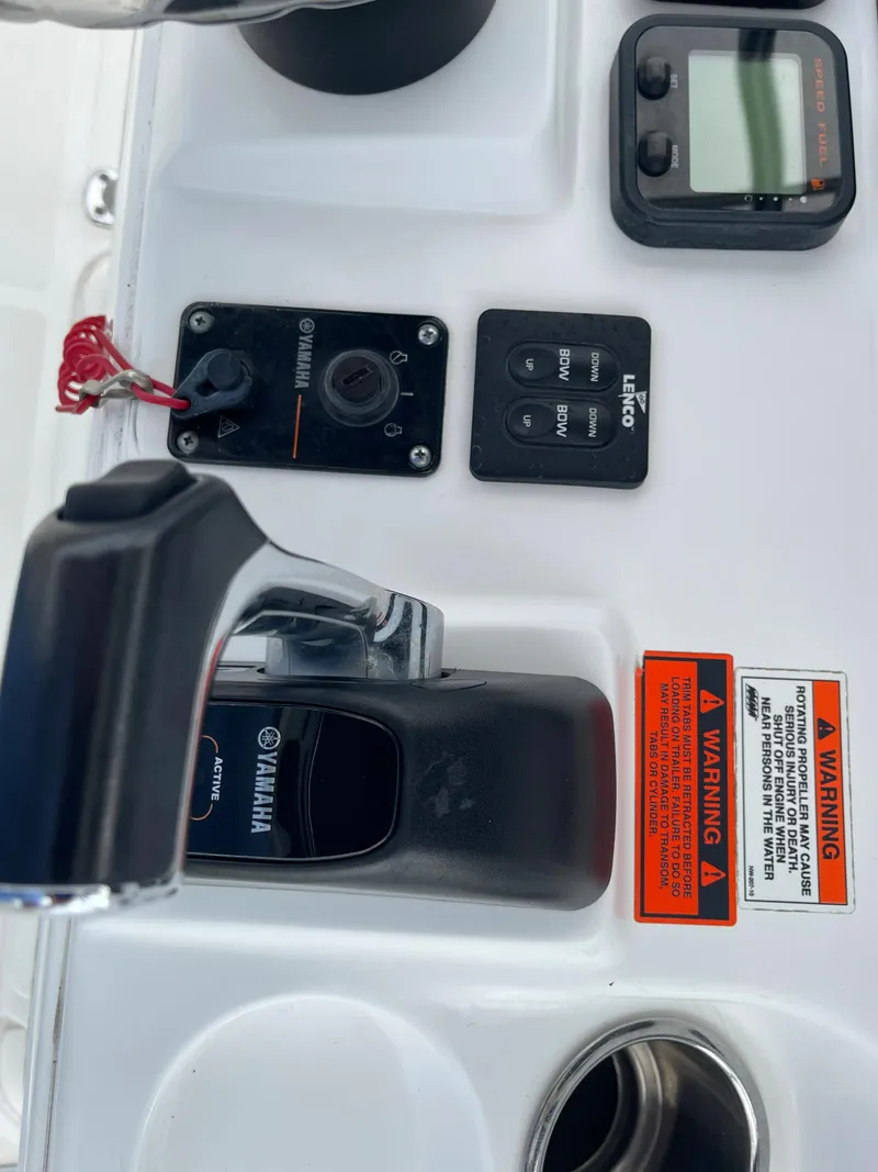 Slide: The Image of Control console of a 2015 Sea Hunt Ultra 234 boat. - 27