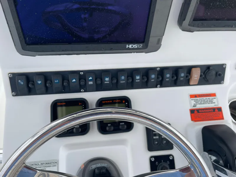 Slide: The Image of Control console of a 2015 Sea Hunt Ultra 234 boat. - 29