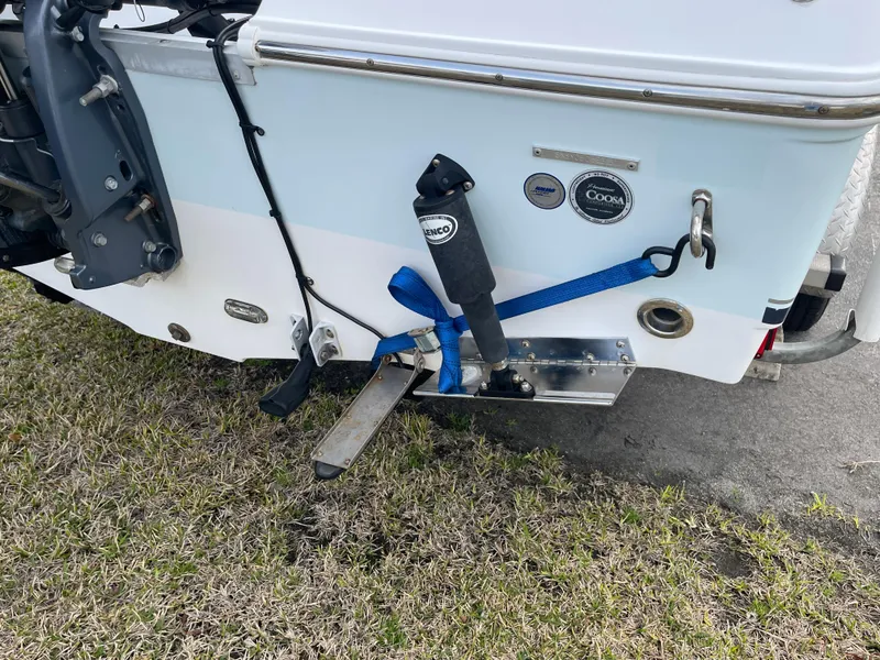 Slide: The Image of Rear view of a 2015 Sea Hunt Ultra 234 boat with motor. - 34