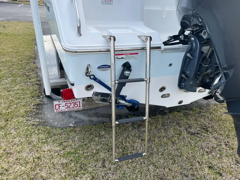 Slide: The Image of 2015 Sea Hunt Ultra 234 boat with ladder and motor. - 36