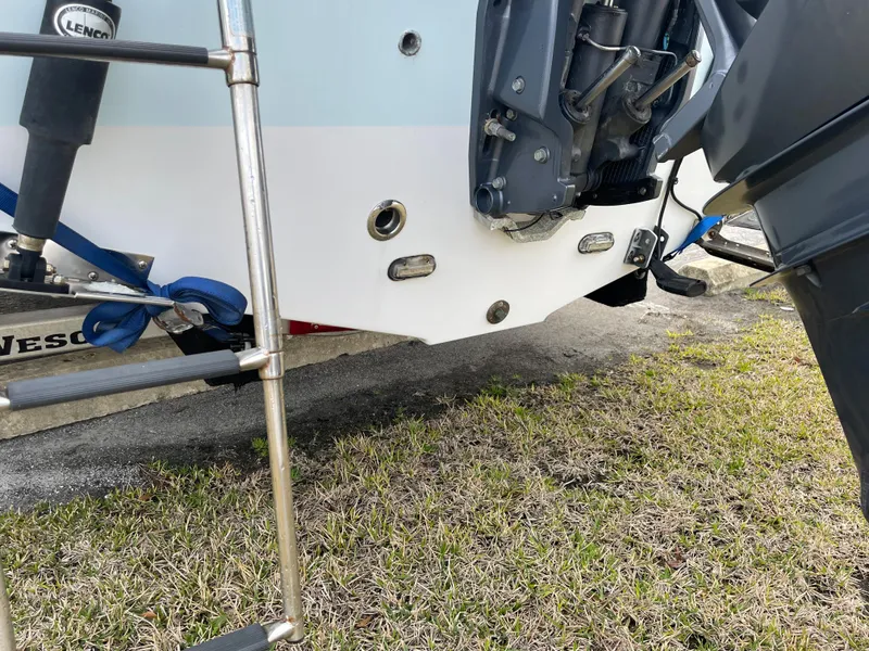 Slide: The Image of Rear view of a 2015 Sea Hunt Ultra 234 boat with motor. - 37