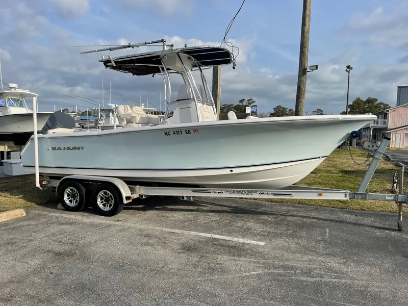 Slide: The Image of 2015 Sea Hunt Ultra 234 boat on trailer outdoors. - 4