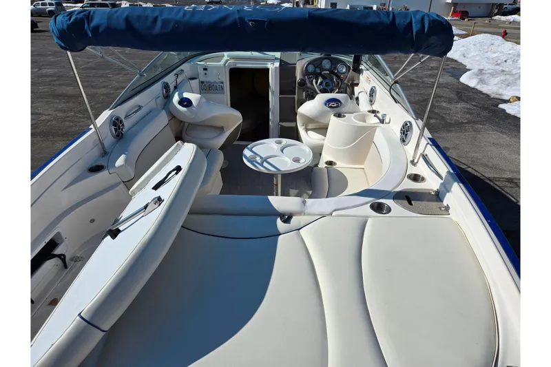 Slide: The Image of 2007 Rinker 246 Captiva Cuddy boat interior with seating and steering wheel. - 10