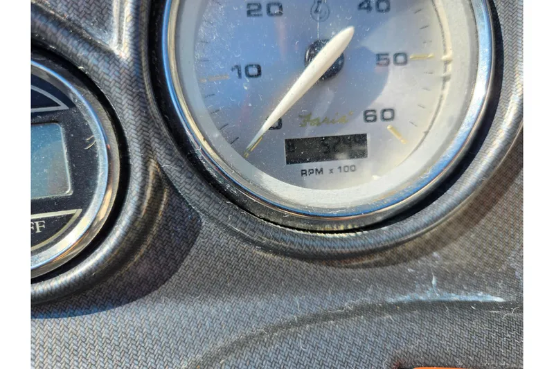 Slide: The Image of Close-up of 2007 Rinker 246 Captiva Cuddy boat dashboard gauges. - 24