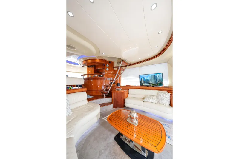 Slide: The Image of Luxurious interior of 2007 Azimut 68E yacht with elegant seating and modern decor. - 11