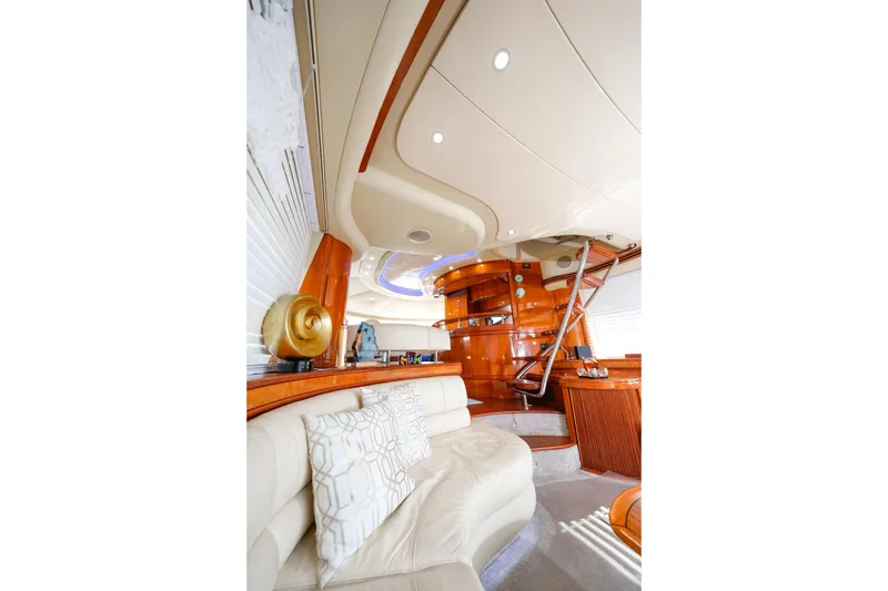 Slide: The Image of Luxurious interior of 2007 Azimut 68E yacht with elegant wood finishes and plush seating. - 12