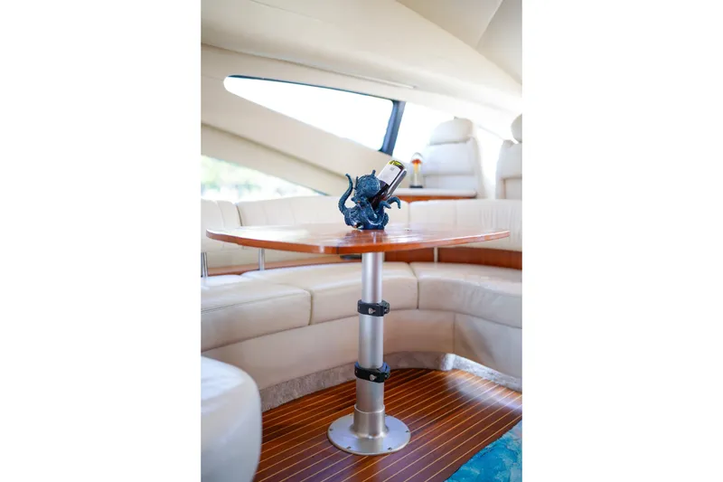 Slide: The Image of Luxurious interior of 2007 Azimut 68E yacht with elegant seating and table. - 16