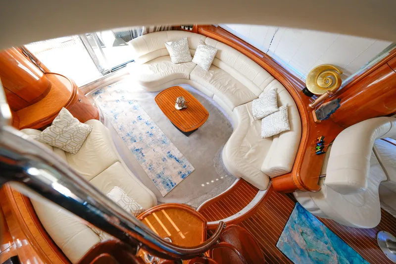 Slide: The Image of Luxurious interior of 2007 Azimut 68E yacht with elegant white seating and wooden accents. - 18