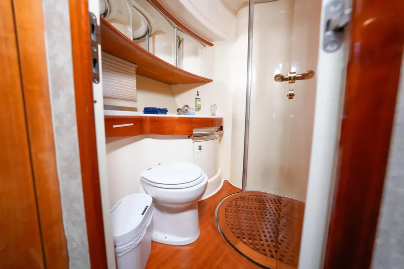 Slide: The Image of Luxurious bathroom in 2007 Azimut 68E yacht with modern fixtures and wooden accents. - 29