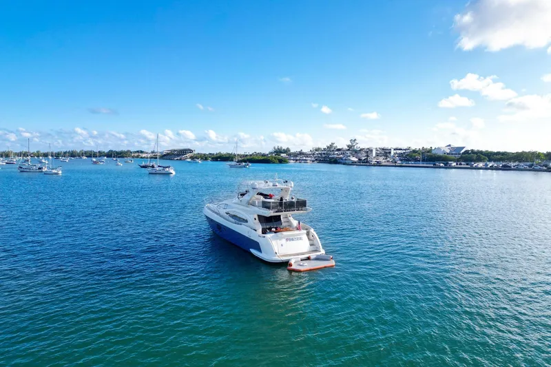 Slide: The Image of 2007 Azimut 68E yacht on serene blue waters under a clear sky. - 3