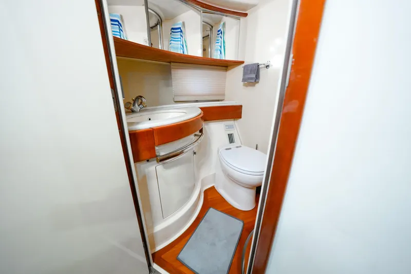 Slide: The Image of Luxurious bathroom in 2007 Azimut 68E yacht with modern fixtures and elegant design. - 32
