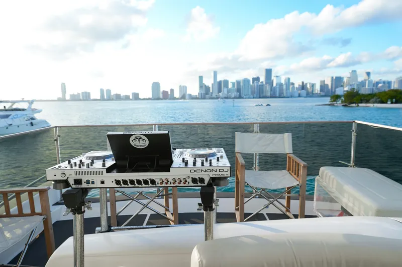 Slide: The Image of DJ setup on 2007 Azimut 68E yacht with city skyline view. - 34