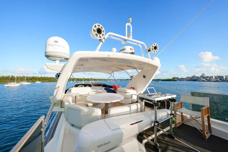 Slide: The Image of Luxurious 2007 Azimut 68E yacht with spacious deck and modern amenities on serene water. - 36