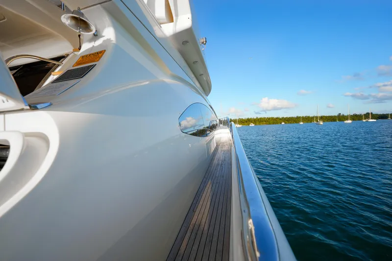 Slide: The Image of Side view of 2007 Azimut 68E yacht on calm blue water. - 41