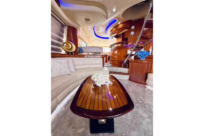 Slide: The Image of Luxurious interior of 2007 Azimut 68E yacht with elegant wood cabinetry and modern TV setup. - 52