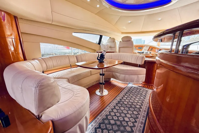 Slide: The Image of Luxurious interior of 2007 Azimut 68E yacht with elegant seating and scenic windows. - 53