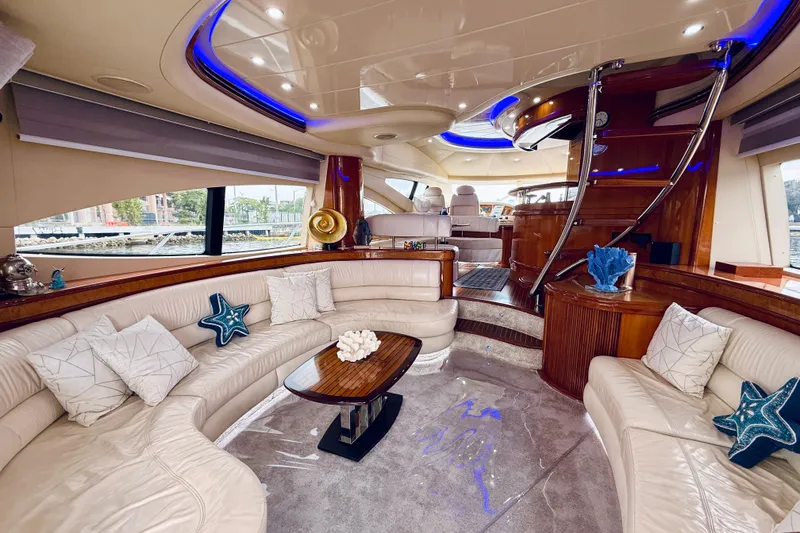 Slide: The Image of Luxury Azimut 68E yacht deck with seating, table, and American flag, 2007 model. - 60