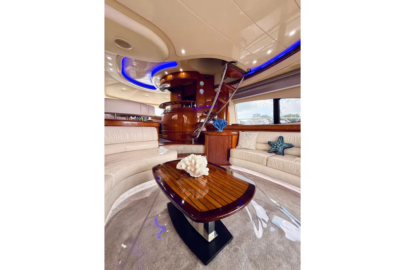 Slide: The Image of Outdoor seating on 2007 Azimut 68E yacht with ocean view and bridge in background. - 63