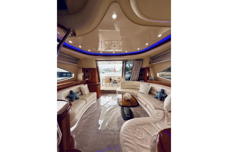 Slide: The Image of 2007 Azimut 68E yacht with sleek deck design on open water. - 70