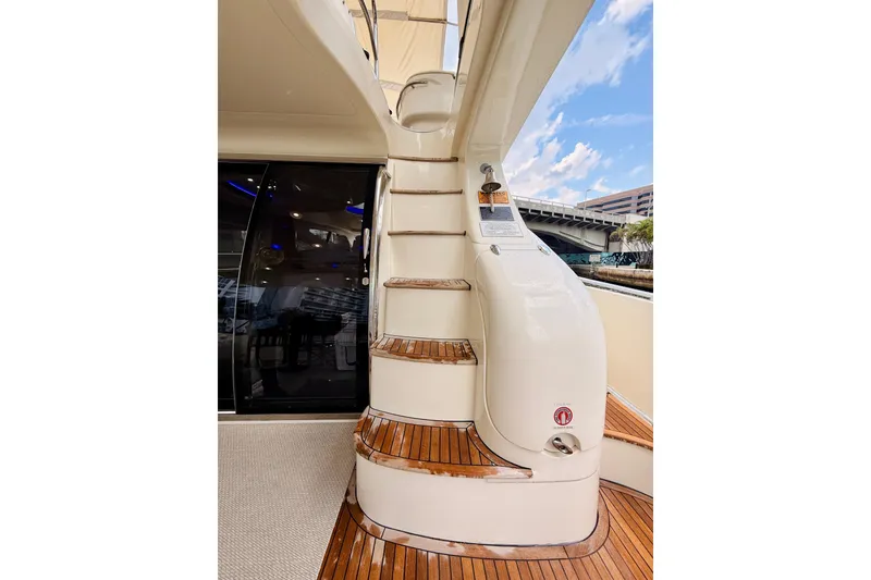 Slide: The Image of Staircase on 2007 Azimut 68E yacht with teak steps and sleek design. - 74