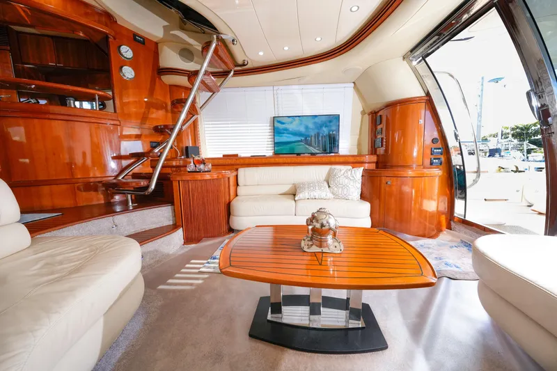 Slide: The Image of Luxurious 2007 Azimut 68E yacht interior with elegant wood finishes and modern furnishings. - 9