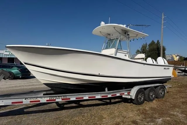 The Image of 2002 Regulator 26 Forward Seating boat on trailer, side view. - 0