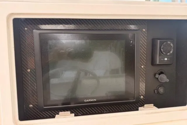 Slide: The Image of Garmin display on 2002 Regulator 26 Forward Seating boat dashboard. - 14