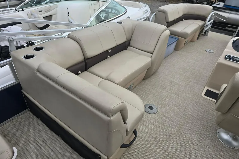 Slide: The Image of 2019 Sun Tracker Party Barge 22 Sport Fish with beige seating and spacious deck layout. - 13