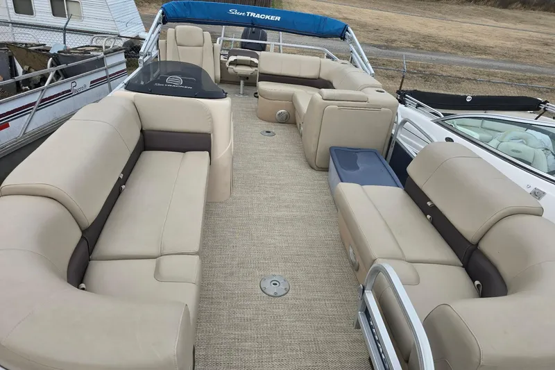 Slide: The Image of 2019 Sun Tracker Party Barge 22 Sport Fish pontoon boat with spacious seating and beige upholstery. - 7