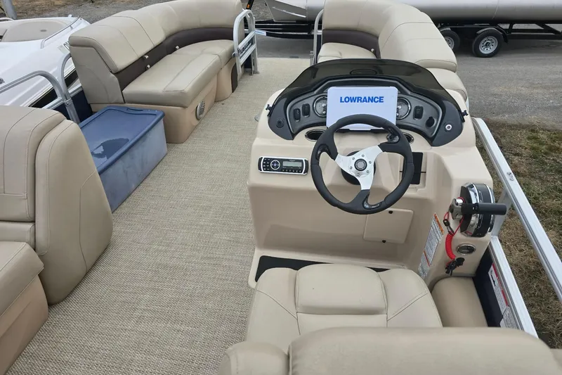 Slide: The Image of 2019 Sun Tracker Party Barge 22 Sport Fish interior with steering console and seating. - 9