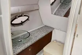 Slide: The Image of 2025 Crownline 250 XSS boat interior with modern bathroom amenities. - 11