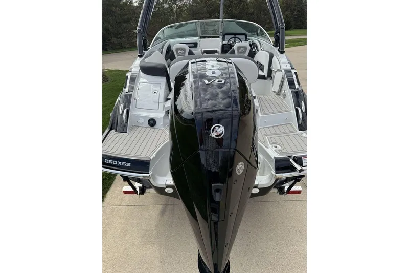 Slide: The Image of 2025 Crownline 250 XSS boat with powerful V8 engine, rear view. - 4