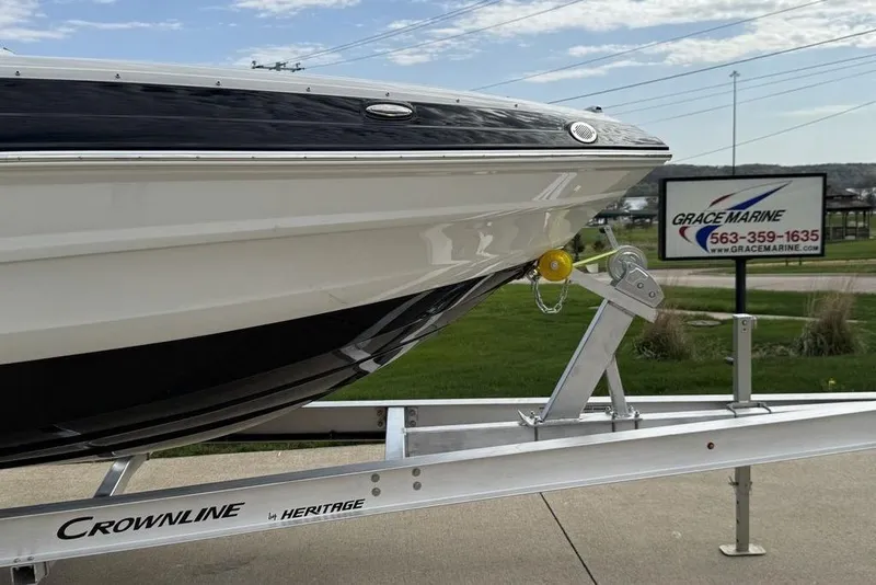 Slide: The Image of 2025 Crownline 250 XSS boat on trailer at Grace Marine dealership. - 5