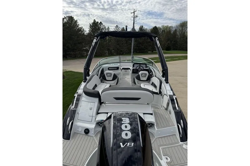 Slide: The Image of 2025 Crownline 250 XSS boat with V8 engine, sleek interior, and modern design. - 6