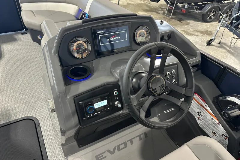 Slide: The Image of 2026 Evotti 523QL boat dashboard with steering wheel and control panel. - 4