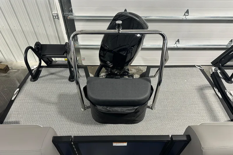 Slide: The Image of 2026 Evotti 523QL boat interior with motor, chrome railing, and seating. - 7