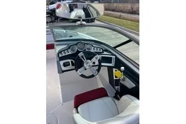 Slide: The Image of 2013 MasterCraft X30 boat dashboard with steering wheel and controls. - 11