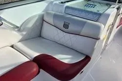 Slide: The Image of 2013 MasterCraft X30 boat interior with white and red seating. - 2