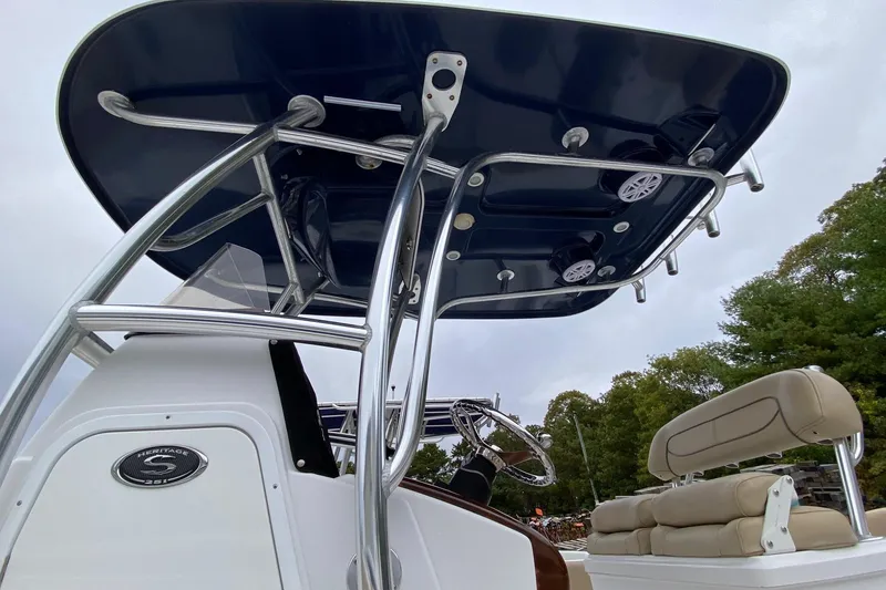 Slide: The Image of 2015 Sportsman Heritage 251 Center Console boat with T-top and seating, viewed from below. - 8