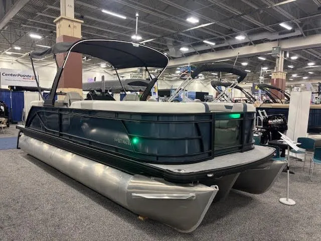 The Image of Godfrey SW2286SBC 2026 pontoon boat displayed at a trade show. - 0