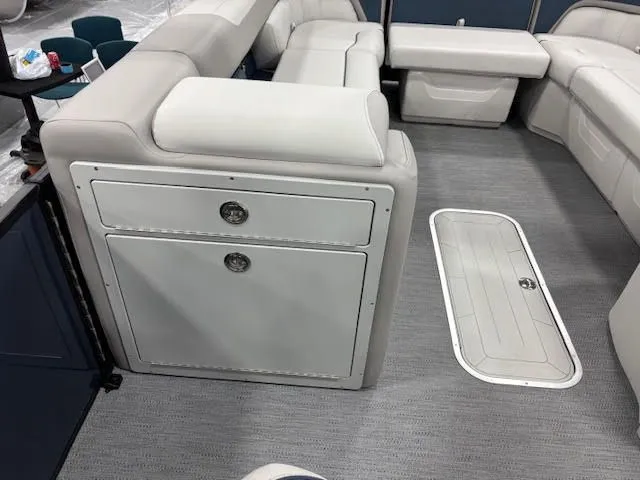 Slide: The Image of Interior of a 2026 Godfrey SW2286SBC boat with gray upholstery. - 13