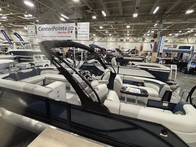 Slide: The Image of Godfrey SW2286SBC 2026 pontoon boat displayed at a boat show. - 8