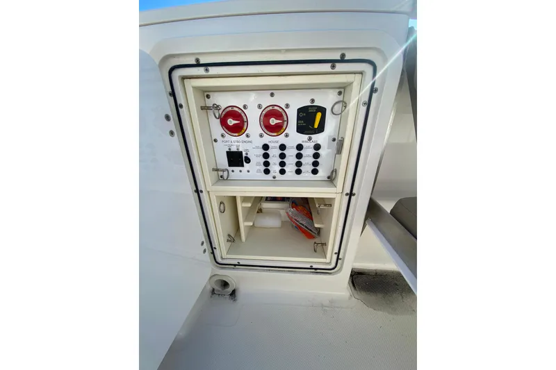 Slide: The Image of Control panel of 2015 Pursuit S 280 Sport boat, featuring engine and electrical switches. - 7