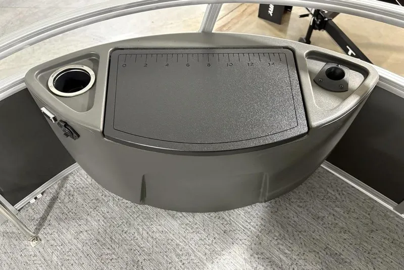 Slide: The Image of 2026 Sun Tracker Bass Buggy 18 DLX console with cup holder and measurement board. - 3