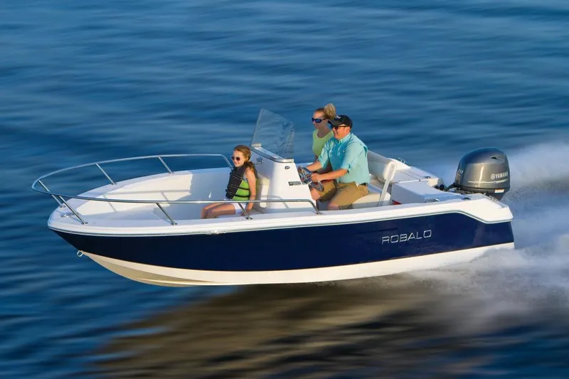 The Image of Manufacturer Provided Image: 2021 Robalo R160 Center Console boat cruising on water with passengers. - 0