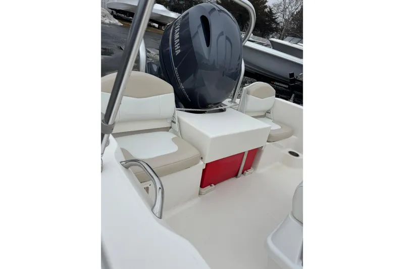 Slide: The Image of 2021 Robalo R160 Center Console boat interior with Yamaha engine and seating. - 12