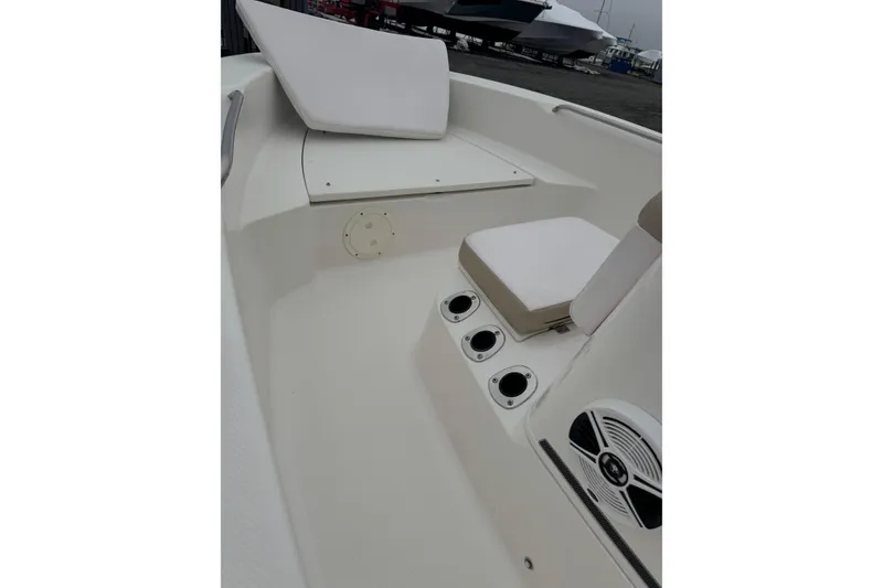 Slide: The Image of 2021 Robalo R160 Center Console boat interior with seating and speaker. - 6