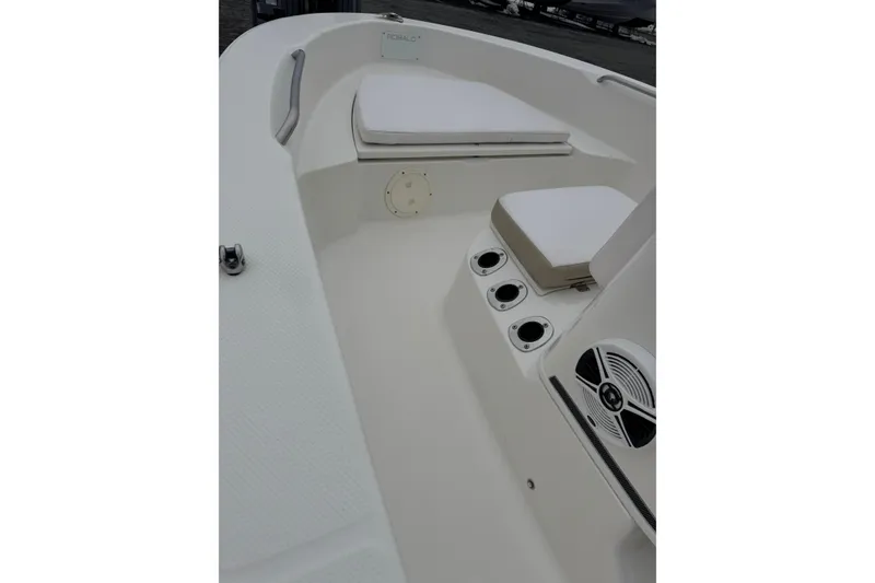 Slide: The Image of 2021 Robalo R160 Center Console boat interior with seating and cup holders. - 7